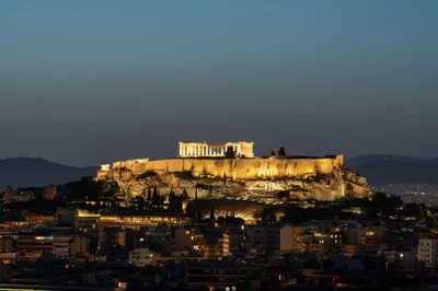 a view of the acropolis of athens at night at Urban APT with Stunning Acropolis View & Roofdeck in Athens
