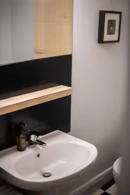 a bathroom with a white sink and a toilet at THE CACTI HOUSE in Athens