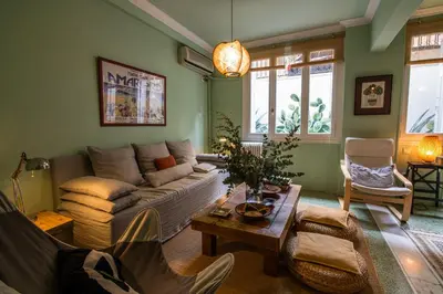 a living room with a couch and a table at THE CACTI HOUSE in Athens