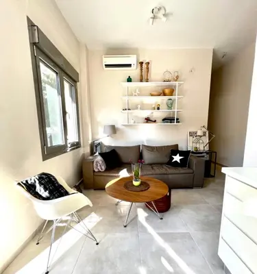 a living room with a couch and a table at Nikaia Metro House in Piraeus