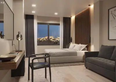 a bedroom with a bed and a desk and a couch at Athens Tower in Athens
