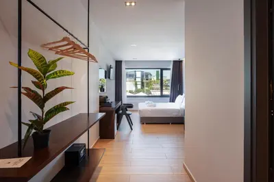a living room with a desk and a bedroom at Athens Tower in Athens