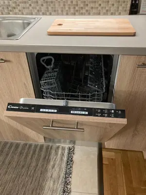 an oven with its door open in a kitchen at Bijou Kalamakiou (Athens Riviera) in Athens