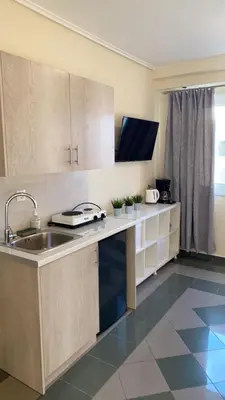 a kitchen with a sink and a counter top at Dina apartment in Athens