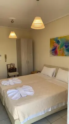 two beds in a bedroom with two towels on them at Athens apartment in Athens