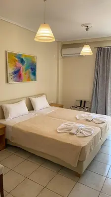 a bedroom with a bed with two towels on it at Athens apartment in Athens
