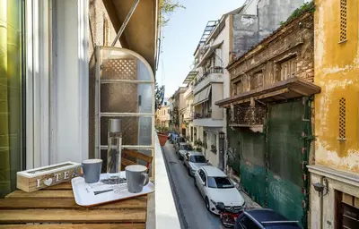 a view of a street with a car on a balcony at New Apartment in the Heart of Plaka in Athens
