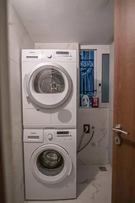 a washing machine and a washer in a bathroom at A11 Pristine & comfy studio near Plaka & Parthenon in Athens