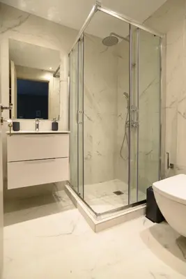 a bathroom with a shower and a sink at A13 Pristine & Sunny 30m2 flat near Syntagma sq in Athens