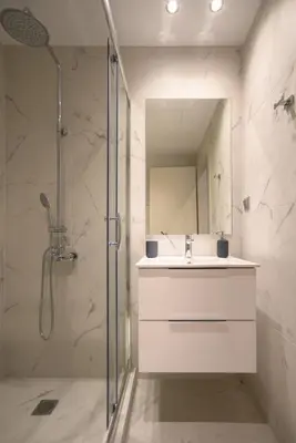 a bathroom with a shower and a sink and a mirror at A16 Premium suite near Plaka in Athens center in Athens