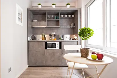 a small kitchen with a table and a tableablish at A16 Premium suite near Plaka in Athens center in Athens