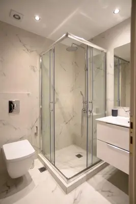 a bathroom with a shower and a toilet and a sink at A16 Premium suite near Plaka in Athens center in Athens