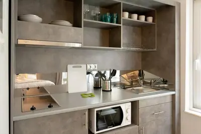 a kitchen with a sink and a microwave at A16 Premium suite near Plaka in Athens center in Athens