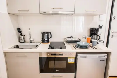 a small kitchen with a sink and a stove at A22 Premium flat with balcony in the centre in Athens