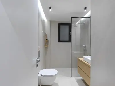 a white bathroom with a toilet and a sink at FRESH, NEW & READY FOR YOU! RNVTD APT IN KOUKAKI! in Athens