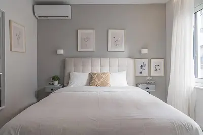 a white bedroom with a large bed in a room at A12 Pristine 1bedrooom flat near Parthenon in Athens' heart in Athens