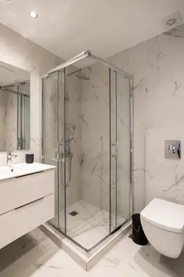 a bathroom with a shower and a toilet and a sink at A12 Pristine 1bedrooom flat near Parthenon in Athens' heart in Athens