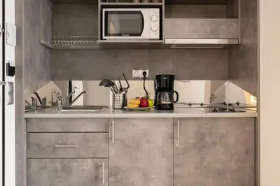 a kitchen with a sink and a microwave at A12 Pristine 1bedrooom flat near Parthenon in Athens' heart in Athens