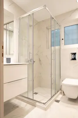 a bathroom with a glass shower stall and a toilet at A17 Modern & Cosy 2Room flat up to 4ppl near Parthenon, 1Bedroom 1livingroom in Athens