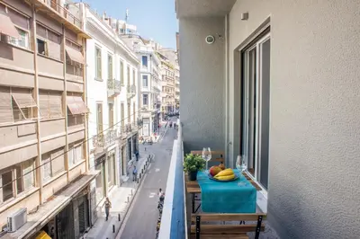 an apartment balcony with a table with bananas on it at A23 Premium suite with balcony near Parthenon in Athens