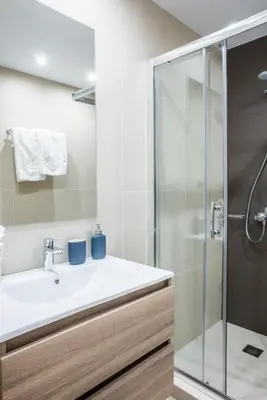 a bathroom with a sink and a shower at A23 Premium suite with balcony near Parthenon in Athens