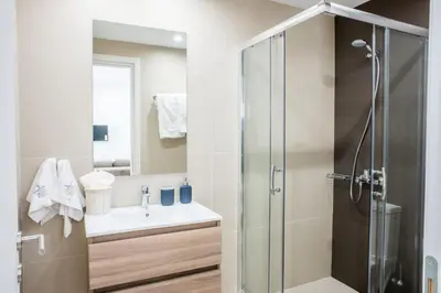 a bathroom with a shower and a sink at A23 Premium suite with balcony near Parthenon in Athens