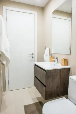 a bathroom with a sink and a mirror at A21 Premium Suite a breath away from Parthenon! in Athens