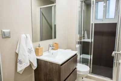 a bathroom with a sink and a toilet and a shower at A21 Premium Suite a breath away from Parthenon! in Athens