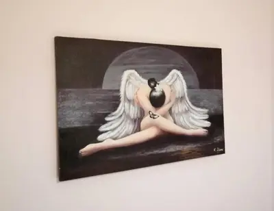 a painting of an angel sitting on a wall at Stunning Acropolis view apartment in Athens