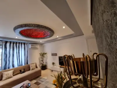 a living room with a couch and a table at Arman Group in Athens