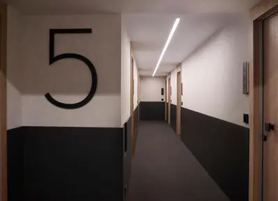 a hallway with a large number on the wall at The Port Square Hotel in Piraeus