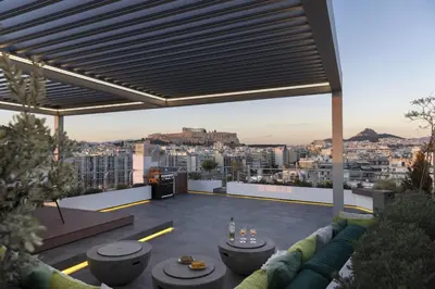 a rooftop patio with a view of the city at NEW STUNNING PENTHOUSE W/SPECTACULAR VISTAS! in Athens