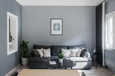 a living room with a couch and a table at Unique 2BR Apartment in Filothei by UPSTREET in Athens