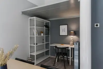 a room with a desk and a shelf at Unique 2BR Apartment in Filothei by UPSTREET in Athens