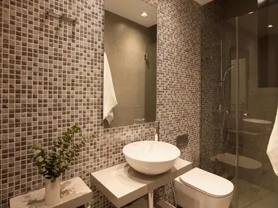 a bathroom with a sink and a toilet at Del Taso 1850 in Athens