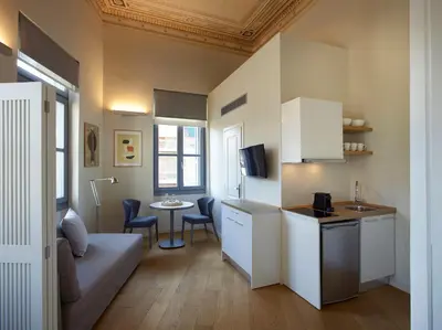 a small apartment with a couch and a table at Del Taso 1850 in Athens