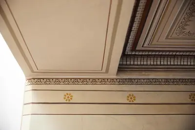 a room with a ceiling with gold decorations on it at Del Taso 1850 in Athens