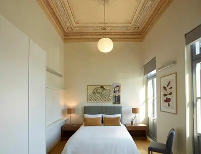 a bedroom with a white bed with a ceiling at Del Taso 1850 in Athens