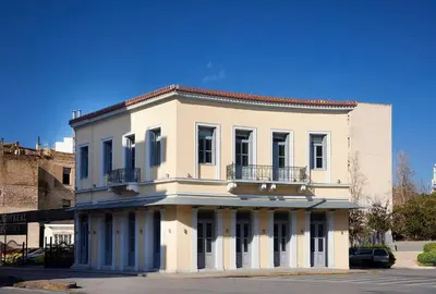 a white building with a balcony on top of it at Del Taso 1850 in Athens