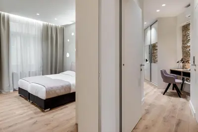 a bedroom with a bed and a desk at J&A Luxury Residence in Athens