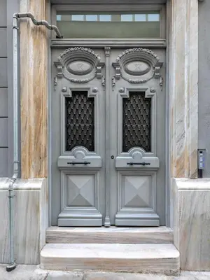 a large metal door on the side of a building at J&A Luxury Residence in Athens