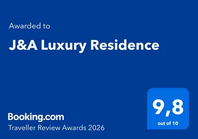 a blue screen with the text awarded to usta luxury resilience at J&A Luxury Residence in Athens