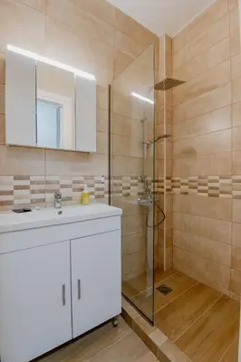 a bathroom with a sink and a shower at Kallithea Gardenspot in Athens