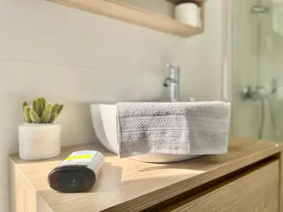 a bathroom with a sink and a towel on a counter at CK apartment view acropole in Athens