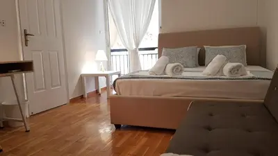 a bedroom with a bed with towels on it at Maisonaitte-Athens Center, 4 BD, 2 BATH in Athens