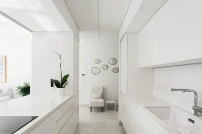 a white bathroom with a sink and a mirror at Athens Observatory Suite in Athens