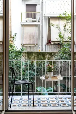 a patio with a table and two chairs on a balcony at Cozy apartment in the center of Athens in Athens