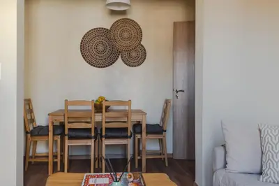 a dining room with a table and chairs at Living Stone Aparthotel in Athens