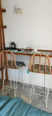 a table and two chairs in a room at Παραθαλασσιο στουντιο Μιχαλιας Sea view studio Michalias Νουμερο 8 in Agia Marina Aegina