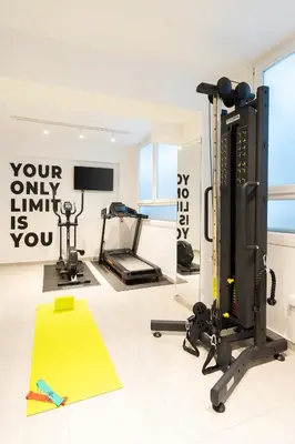 a room with a gym with a treadmill at My Greek Vacations City Apartments in Athens